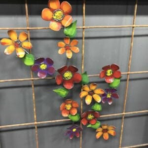 Flower Stem Metal Wall Art: A Metal Wall Art Piece Featuring A Flower Stem Design