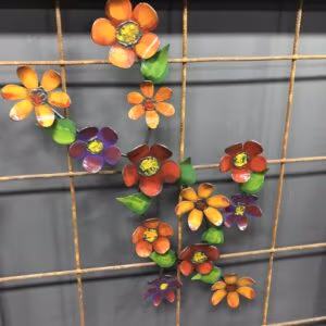 Flower Stem Metal Wall Art: A Metal Wall Art Piece Featuring A Flower Stem Design